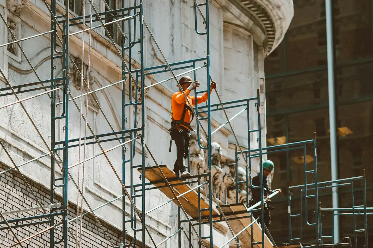 Scaffolding providing working access across the elevation of a building