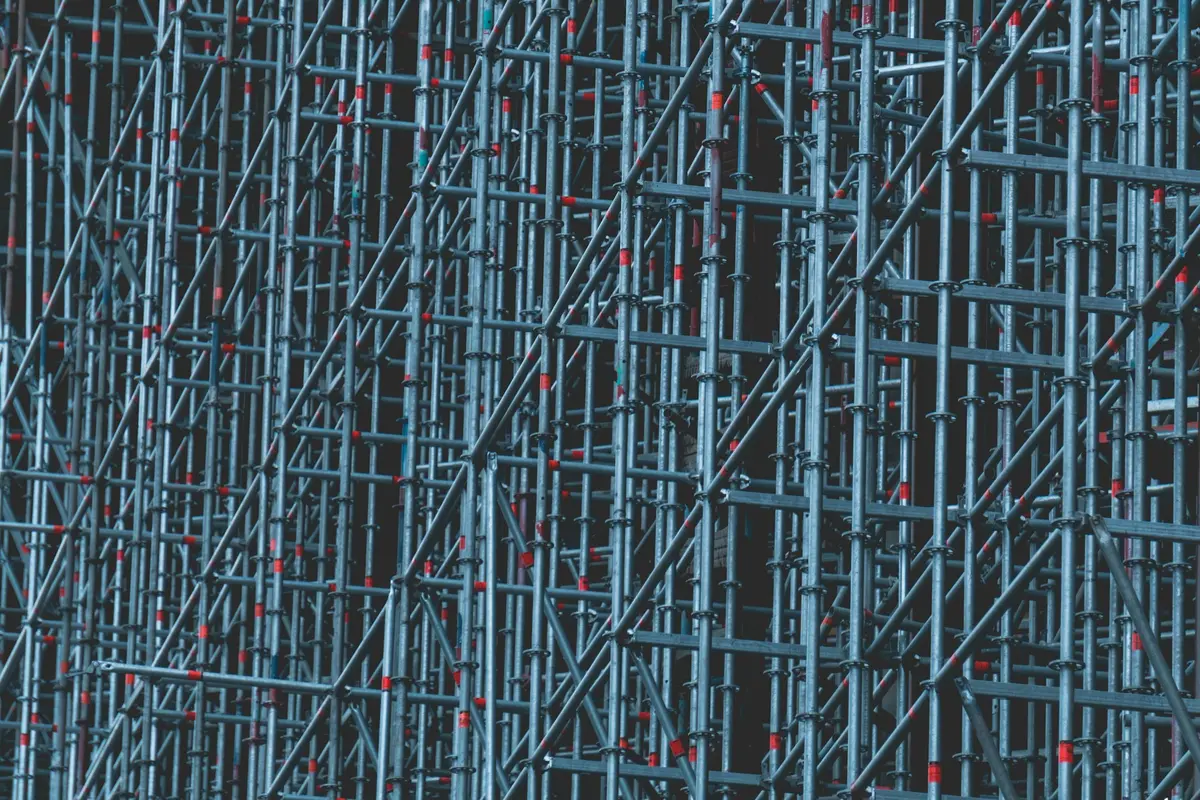 Detail of a steel scaffold structure with braces and boarded platform